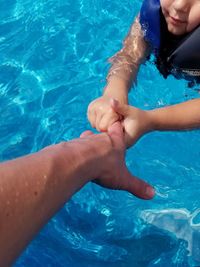 Low section of people in swimming pool