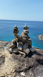 Stacks of stones against sea