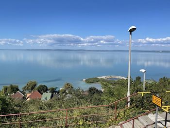 Street by sea against sky