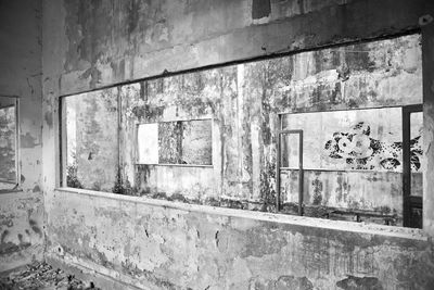 Damaged window in abandoned building