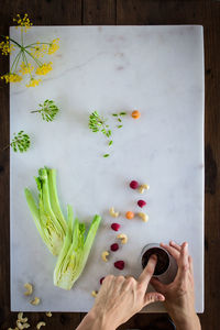 Directly above shot of person holding bread on cutting board