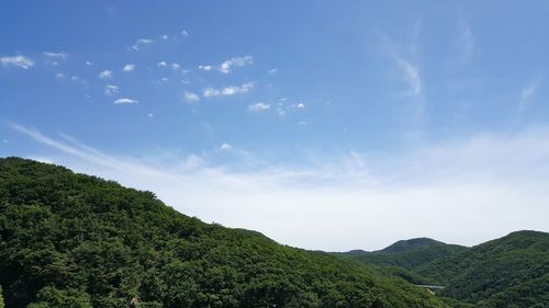 Scenic view of landscape against blue sky