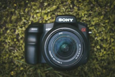 Directly above shot of digital camera on field