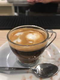 Close-up of cappuccino on table