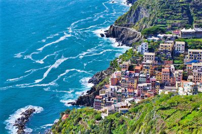 Aerial view of buildings by sea