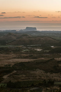 Scenic view of landscape against sky during sunset