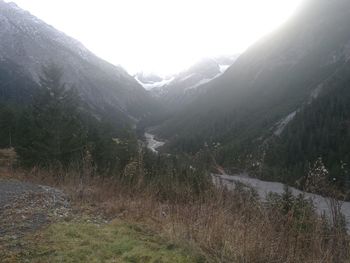 Scenic view of mountains during foggy weather