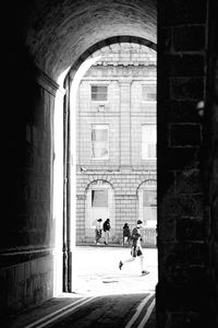 People walking in front of building