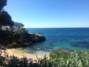 Scenic view of sea against clear blue sky