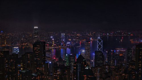 High angle view of illuminated city buildings at night