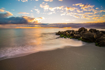 Scenic view of sea at sunset