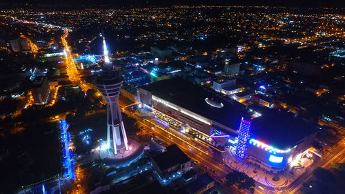 High angle view of illuminated city buildings at night