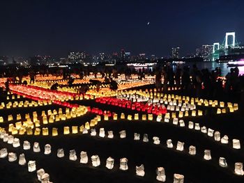 High angle view of illuminated buildings in city at night