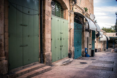 Empty alley amidst buildings