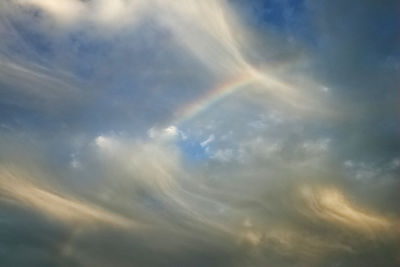 Low angle view of rainbow in sky