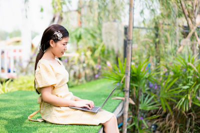 Side view of young woman looking away