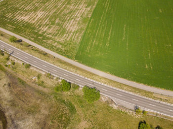 High angle view of road amidst field