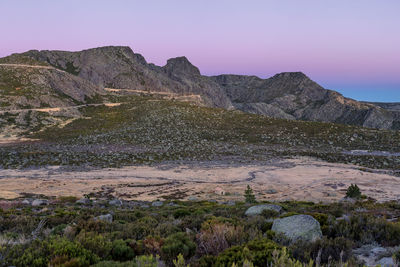 Scenic view of rocky mountains against clear sky