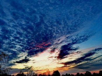 Low angle view of dramatic sky during sunset