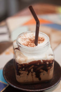 Close-up of coffee in glass on table