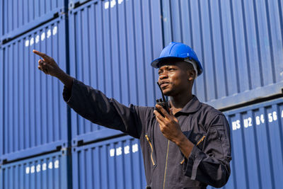 Worker pointing away at dock