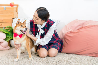 Full length of woman with dog