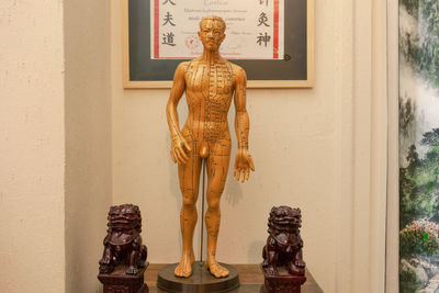 Statue against wall in building