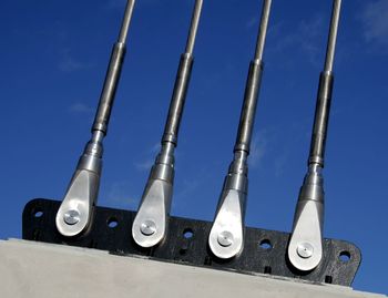 Low angle view of pipes against sky