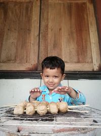 Portrait of smiling boy holding ice cream