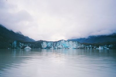 Scenic view of frozen lake against sky