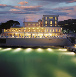 Reflection of illuminated buildings in water at night