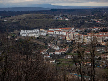 High angle view of townscape and trees in town