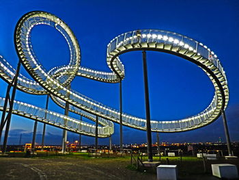 Low angle view of illuminated tiger and turtle against sky