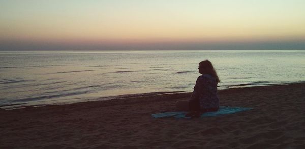 Scenic view of sea at sunset