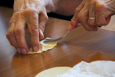 Close-up of man preparing food