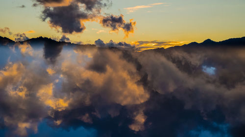 Low angle view of dramatic sky during sunset