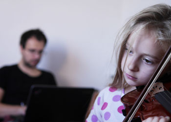 Portrait of young girl playing violine