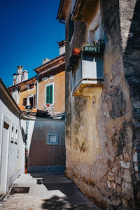 Alley amidst buildings in city