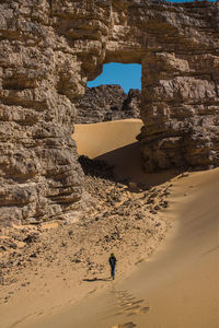 Rear view of man on rock