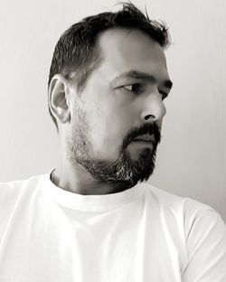 Portrait of young man against white background