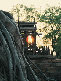 Statue outside temple against sky