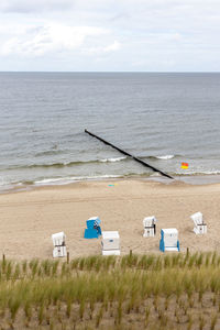 The view of the beach of zempin on the island of usedom with many beach chairs in summer