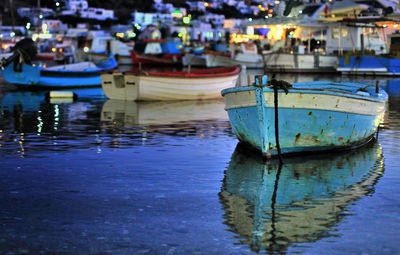 Close-up of boats moored at harbor
