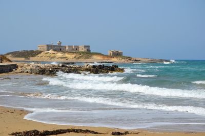 Scenic view of sea against clear sky