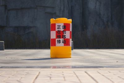 Close-up of yellow stop sign