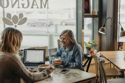 Women having coffee in cafe