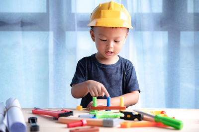 Cute boy playing with toy