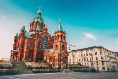 Low angle view of historical building against blue sky