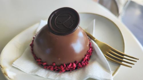 Cropped hand of woman holding dessert