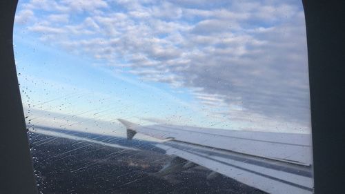 Scenic view of sea seen through airplane window